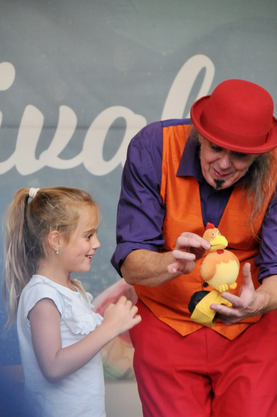 Magician kid and trick with chicken